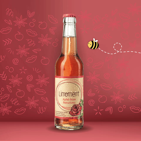 Limoment Apfel-Rose Naturlimo in Glasflasche mit natürlichem Etikett mit Limoment-Logo und gezeichneter Rose.